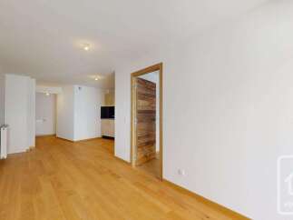 This spacious apartment features a bright and airy living area with beautiful hardwood floors.