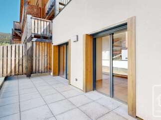 Enjoy the outdoors from this spacious patio, perfect for al fresco dining or relaxing with a view.