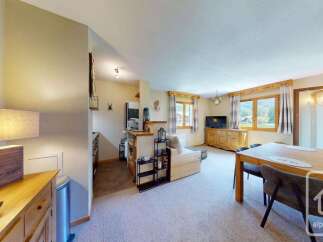 This charming apartment offers a bright and airy living space, perfect for relaxation and entertaining.