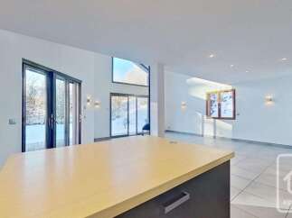 Experience modern living in this spacious open-plan home, featuring a large kitchen island perfect for entertaining.