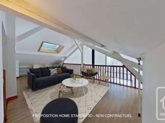 Discover this charming attic living space, perfect for relaxation and entertaining.
