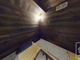 Experience ultimate relaxation in this beautifully crafted wooden sauna.