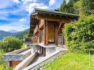 Experience luxury mountain living in this stunning wooden chalet, nestled amidst breathtaking alpine scenery.