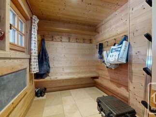 Step into this charming alpine entryway, perfect for storing your ski gear.