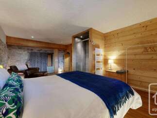 Experience rustic charm and modern comfort in this beautifully appointed bedroom.
