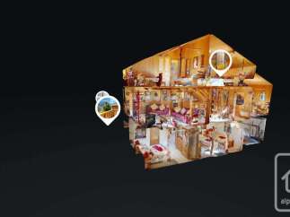 Explore this charming multi-level chalet, showcasing a cozy living area with plush sofas and a rustic fireplace.