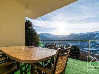 Enjoy breathtaking mountain views from this charming balcony, perfect for al fresco dining or morning coffee.