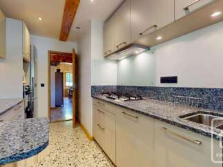 Discover this charming kitchen featuring sleek cabinetry and a stunning granite countertop.