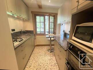 Discover this charming kitchen featuring a gas stovetop and granite countertops, perfect for culinary enthusiasts.