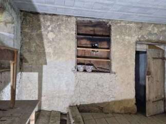 Discover the rustic charm of this property, featuring exposed stone walls and wooden beams that evoke a sense of history.