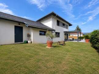 Discover this modern home featuring a spacious backyard perfect for outdoor entertaining.