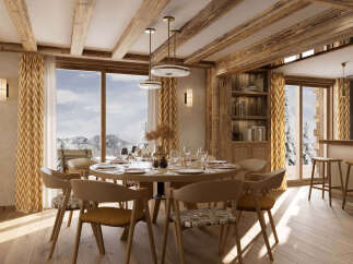 Experience luxurious mountain living in this stunning dining room, featuring a grand round table set for an intimate dinner.