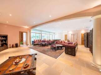 Experience luxurious living in this expansive lounge area, featuring a large seating arrangement perfect for gatherings and entertainment.