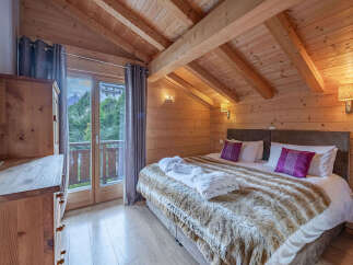 Experience rustic charm and modern comfort in this beautifully appointed bedroom.