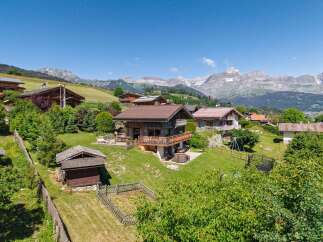 Experience alpine living in this charming chalet nestled amidst breathtaking mountain views.
