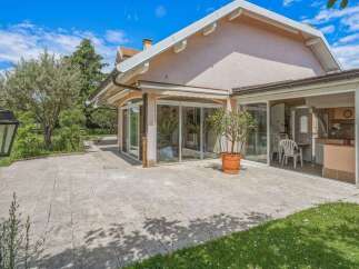 Enjoy outdoor living with this spacious patio, perfect for entertaining or relaxing.