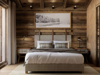 Experience rustic luxury in this charming bedroom, featuring a cozy king-size bed with plush plaid pillows and a warm, wood-paneled accent wall.