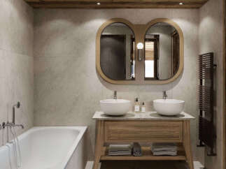 Experience luxury in this modern bathroom featuring a freestanding bathtub and a double vanity with vessel sinks.