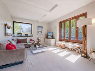 Experience cozy living in this inviting living room, featuring a plush sectional sofa perfect for relaxation.