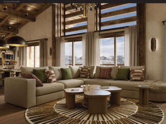 Experience luxury mountain living in this stunning living room, featuring a spacious sectional sofa perfect for cozy evenings.