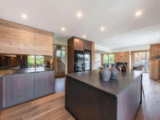 Experience luxury mountain living in this stunning open-plan kitchen and living area.