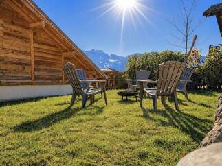 Enjoy the stunning mountain views from this charming outdoor seating area, perfect for relaxing evenings.