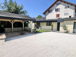 Discover this charming property featuring a covered carport and a beautifully maintained garden area.