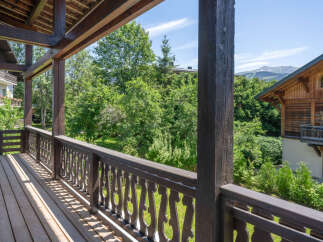 Enjoy the stunning mountain views from this charming wooden balcony, perfect for morning coffee or evening relaxation.