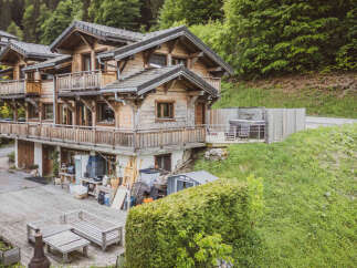 Experience the charm of this multi-level wooden chalet nestled in a serene mountain setting.