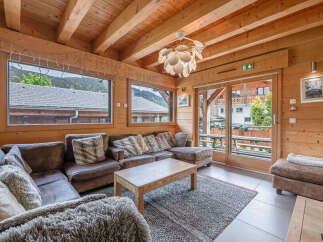 Experience cozy mountain living in this charming wooden chalet living room.