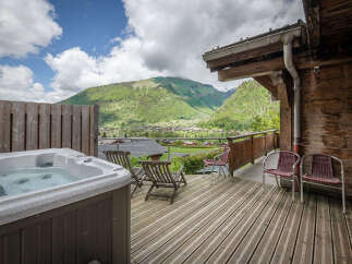 Experience ultimate relaxation with this stunning mountain view hot tub, perfect for unwinding after a day of adventure.