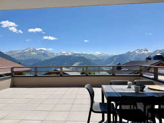 Enjoy breathtaking mountain views from this stunning balcony, perfect for outdoor dining or morning coffee.