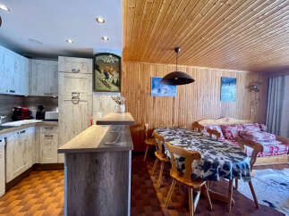 This charming property features a well-equipped kitchen with modern appliances and ample cabinet space, perfect for preparing meals.