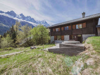 Experience the ultimate mountain retreat in this stunning wooden chalet, complete with a luxurious hot tub on the expansive deck.