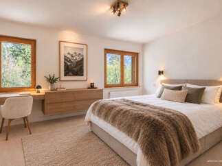 Experience serene mountain living in this beautifully appointed bedroom, featuring large wooden-framed windows that offer stunning natural views.