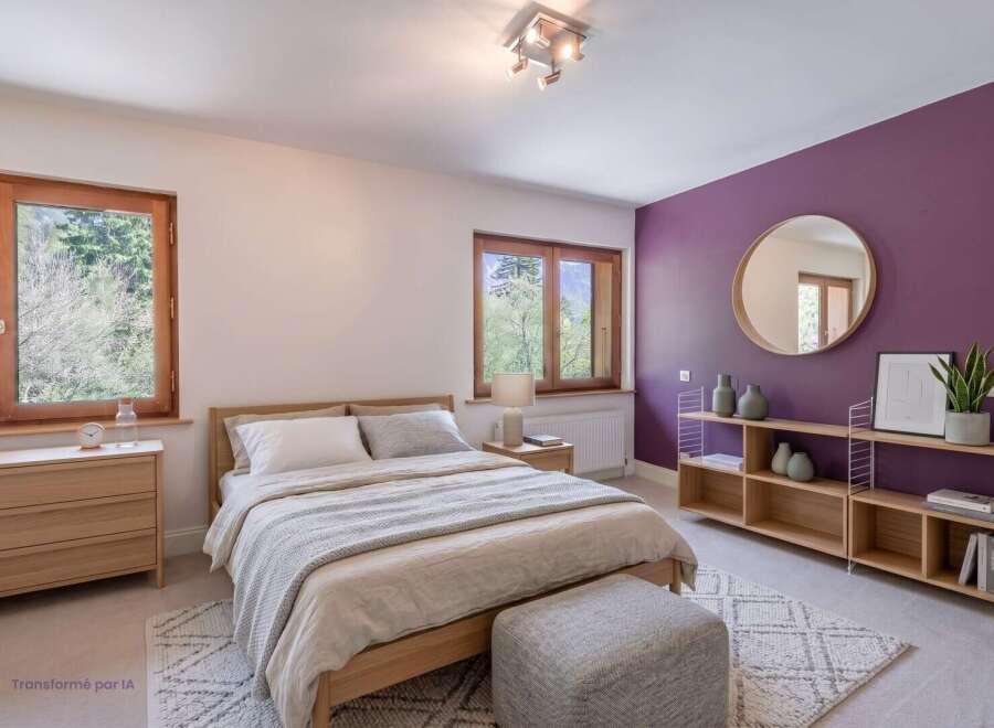This beautifully appointed bedroom features a comfortable wooden bed with crisp white linens and a cozy grey throw.