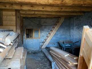 Discover the potential of this rustic interior, perfect for renovation projects.