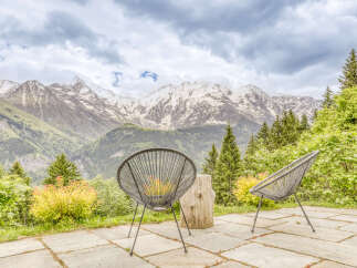 Experience breathtaking mountain views from this stunning patio, perfect for enjoying your morning coffee or evening relaxation.