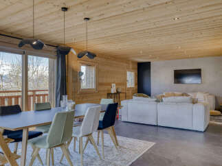 Experience modern mountain living in this stunning open-concept dining and living area.