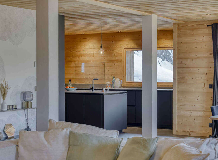 Experience modern mountain living in this stunning open-plan kitchen and living area.