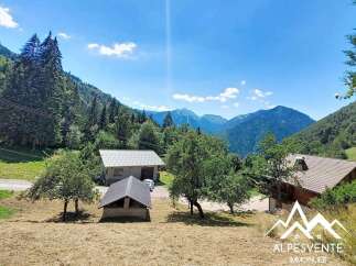 Discover this charming property nestled in a serene mountain landscape, perfect for those seeking tranquility and nature.