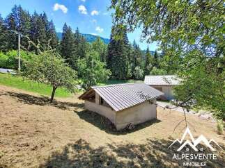 Discover this charming property nestled in a serene mountain landscape, perfect for those seeking tranquility.