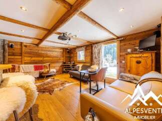 Experience cozy mountain living in this charming wooden chalet, featuring exposed beams and a warm, inviting atmosphere.