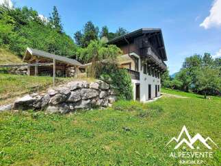 Discover this charming property nestled in a serene, green landscape.