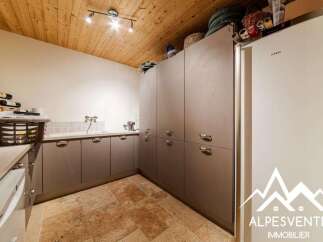 Discover this charming kitchen featuring a practical sink area with ample counter space and storage cabinets.