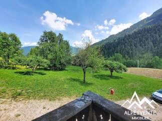 Enjoy breathtaking mountain views from this charming property, nestled amidst lush greenery and mature trees.
