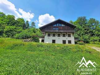 Discover this charming chalet nestled amidst lush greenery, offering a serene mountain retreat.