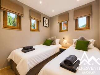 This charming bedroom features two comfortable twin beds, perfect for accommodating guests or family.