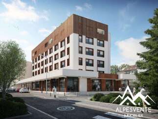 Discover modern living in this stunning new development, featuring a striking facade with white and wood accents.