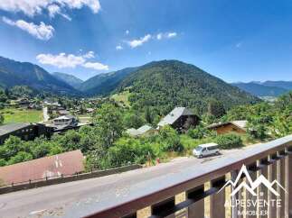 Experience breathtaking mountain views from this stunning property, nestled amidst lush greenery and charming alpine architecture.